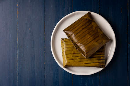 Prehispanic dish typical of Mexico and some Latin American countries. Corn dough wrapped in banana leaves. The tamales are steamed.の写真素材
