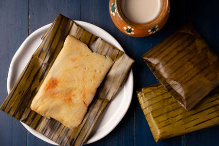 Prehispanic dish typical of Mexico and some Latin American countries. Corn dough wrapped in banana leaves. The tamales are steamed.の写真素材