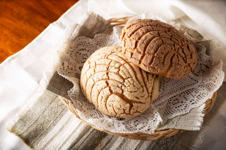 shells. Mexican sweet bread roll with seashell-like appearance, Usually eaten with coffee or hot chocolate at breakfast or as an afternoon snack.の写真素材