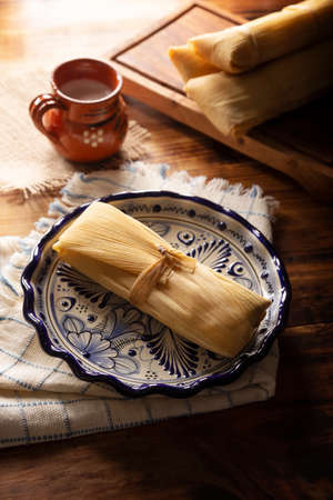 Prehispanic dish typical of Mexico and some Latin American countries. Corn dough wrapped in corn leaves. The tamales are steamed.の写真素材