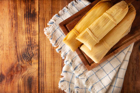 Prehispanic dish typical of Mexico and some Latin American countries. Corn dough wrapped in corn leaves. The tamales are steamed.の写真素材