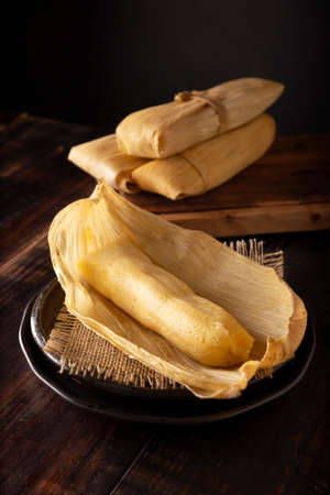 Prehispanic dish typical of Mexico and some Latin American countries. Corn dough wrapped in corn leaves. The tamales are steamed.の写真素材
