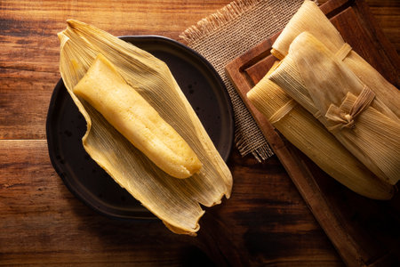 Prehispanic dish typical of Mexico and some Latin American countries. Corn dough wrapped in corn leaves. The tamales are steamed.の写真素材