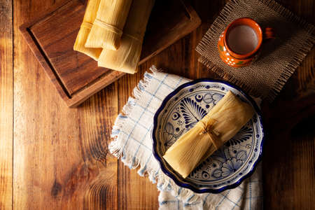 Prehispanic dish typical of Mexico and some Latin American countries. Corn dough wrapped in corn leaves. The tamales are steamed.の写真素材