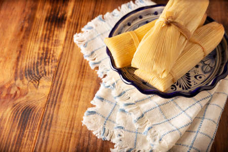 Tamales. Prehispanic dish typical of Mexico and some Latin American countries. Corn dough wrapped in...