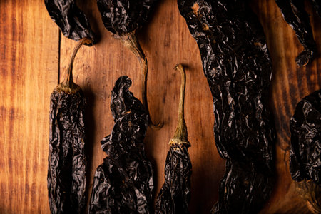 Pasilla. Also known as chile negro or chile prieto. This Mexican chili is the dried form chilaca chili and are used in a variety of Mexican preparations.の写真素材