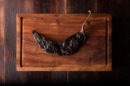 Pasilla. Also known as chile negro or chile prieto. This Mexican chili is the dried form chilaca chili and are used in a variety of Mexican preparations.の写真素材