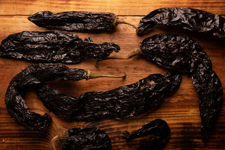 Pasilla. Also known as chile negro or chile prieto. This Mexican chili is the dried form chilaca chili and are used in a variety of Mexican preparations.の写真素材