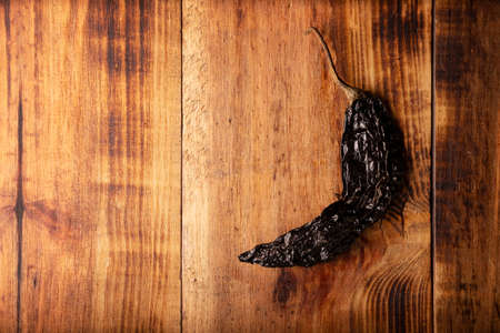 Pasilla. Also known as chile negro or chile prieto. This Mexican chili is the dried form chilaca chili and are used in a variety of Mexican preparations.の写真素材
