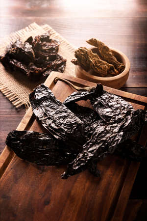 Variety of dried mexican chili. Chile Morita, Chipotle and Pasilla, This Mexican chili is the dried form chilaca chili and are used in a variety of Mexican preparations.の写真素材