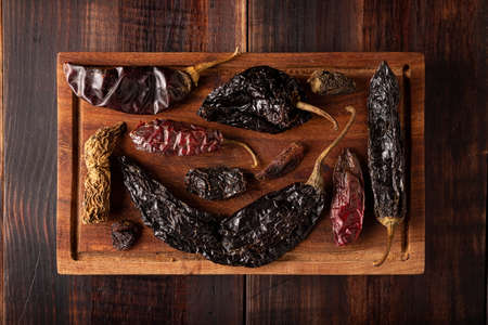 Variety of dried mexican chili. Chile Morita, Guajillo, sChipotle and Pasilla, This Mexican chili is the dried form chilaca chili and are used in a variety of Mexican preparations.の写真素材