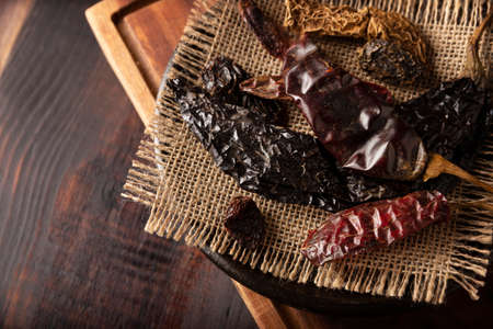 Variety of dried mexican chili. Chile Morita, Guajillo, sChipotle and Pasilla, This Mexican chili is the dried form chilaca chili and are used in a variety of Mexican preparations.の写真素材