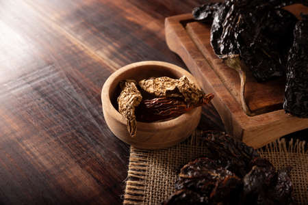 Variety of dried mexican chili. Chile Morita, Chipotle and Pasilla, This Mexican chili is the dried form chilaca chili and are used in a variety of Mexican preparations.の写真素材