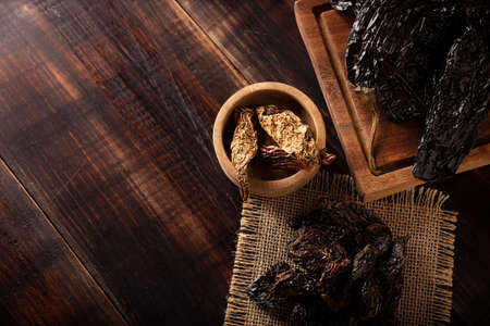 Variety of dried mexican chili. Chile Morita, Chipotle and Pasilla, This Mexican chili is the dried form chilaca chili and are used in a variety of Mexican preparations.の写真素材