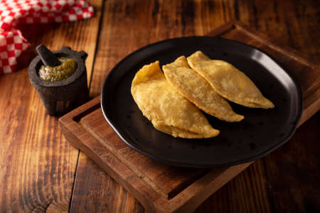 Fried quesadillas. Traditional Mexican appetizer "garnacha". Deep Fried handmade corn tortilla that can be filled with a wide variety of ingredients, cheese, pork rinds, meat, etc.の写真素材