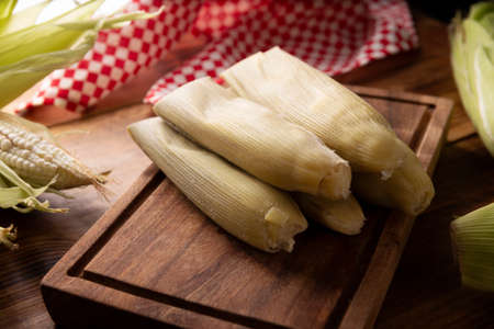 Tamales de Elote, also called Uchepos. Typical Mexican dish. Can be served with green salsa and accompanied by sour cream or served as a dessert covered with caramel or any other sweet toppingの写真素材