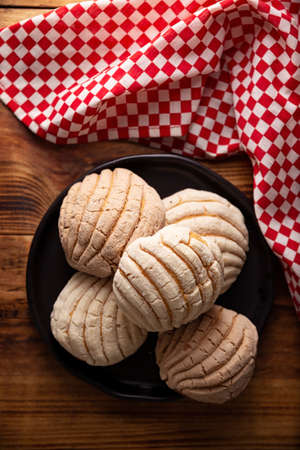 shells. Mexican sweet bread roll with seashell-like appearance, Usually eaten with coffee or hot chocolate at breakfast or as an afternoon snack.の写真素材