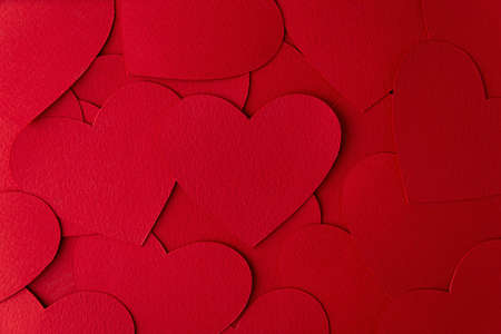 Paper cut red hearts shape background with copy space. Concept image. Valentine's day, mother's day, birthday greeting cards, invitation, celebrationの写真素材