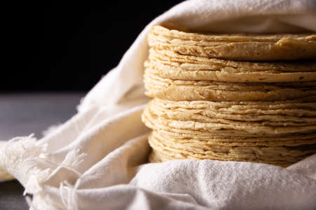Corn Tortillas. Food made with nixtamalized corn, a staple food in several American countries, an essential element in many Latin American dishes.の写真素材