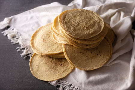 Corn Tortillas. Food made with nixtamalized corn, a staple food in several American countries, an essential element in many Latin American dishes.の写真素材