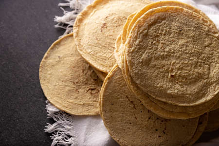 Corn Tortillas. Food made with nixtamalized corn, a staple food in several American countries, an essential element in many Latin American dishes.の写真素材
