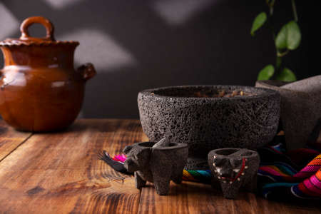 Molcajete. Traditional mexican version of mortar and pestle handmade of volcanic stone. Essential element in the preparation of the authentic Mexican sauce and other dishes.の写真素材