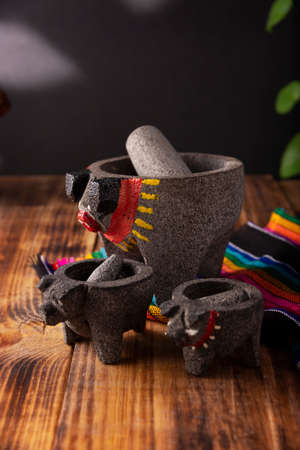 Molcajete. Traditional mexican version of mortar and pestle handmade of volcanic stone. Essential element in the preparation of the authentic Mexican sauce and other dishes.の写真素材