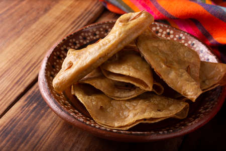 Golden quesadillas. Fried quesadillas made with corn tortillas, they can be filled with any dish or ingredient, such as meat, potato or fish such as marlin or tuna, popular during the Lenten season.の写真素材