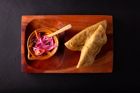 Golden quesadillas. Fried quesadillas made with corn tortillas, they can be filled with any dish or ingredient, such as meat, potato or fish such as marlin or tuna, popular during the Lenten season.の写真素材