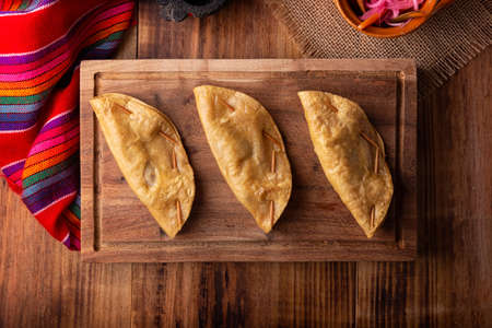 Golden quesadillas. Fried quesadillas made with corn tortillas, they can be filled with any dish or ingredient, such as meat, potato or fish such as marlin or tuna, popular during the Lenten season.の写真素材