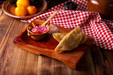 Golden quesadillas. Fried quesadillas made with corn tortillas, they can be filled with any dish or ingredient, such as meat, potato or fish such as marlin or tuna, popular during the Lenten season.の写真素材