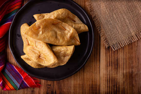 Golden quesadillas. Fried quesadillas made with corn tortillas, they can be filled with any dish or ingredient, such as meat, potato or fish such as marlin or tuna, popular during the Lenten season.の写真素材