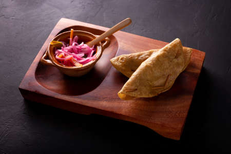 Golden quesadillas. Fried quesadillas made with corn tortillas, they can be filled with any dish or ingredient, such as meat, potato or fish such as marlin or tuna, popular during the Lenten season.の写真素材