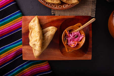 Golden quesadillas. Fried quesadillas made with corn tortillas, they can be filled with any dish or ingredient, such as meat, potato or fish such as marlin or tuna, popular during the Lenten season.の写真素材