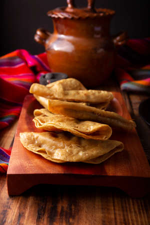 Golden quesadillas. Fried quesadillas made with corn tortillas, they can be filled with any dish or ingredient, such as meat, potato or fish such as marlin or tuna, popular during the Lenten season.の写真素材