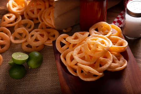 Flour cracklings. Also known as duros, duritos, Mexican wagon wheels or pinwheels, they are a very popular snack made from flour, commonly accompanied with hot sauce and lemon juice.の写真素材