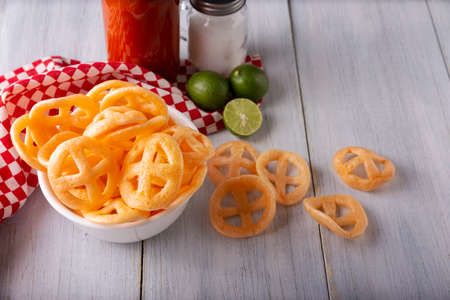 Flour cracklings. Also known as duros, duritos, Mexican wagon wheels or pinwheels, they are a very popular snack made from flour, commonly accompanied with hot sauce and lemon juice.の写真素材
