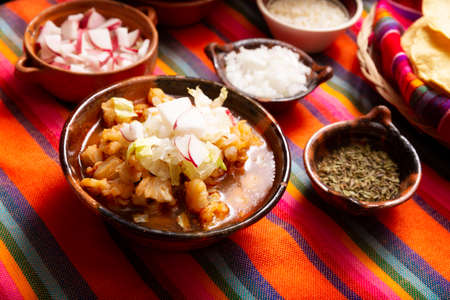 Red pozole. Traditional Mexican stew very popular in Mexico and neighboring countries. Made from cacahuazintle with meat and various other ingredients depending on the region.の写真素材