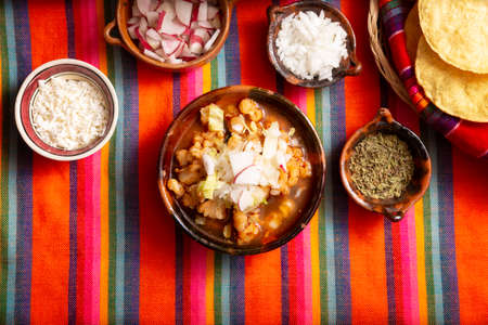 Red pozole. Traditional Mexican stew very popular in Mexico and neighboring countries. Made from cacahuazintle with meat and various other ingredients depending on the region.の写真素材