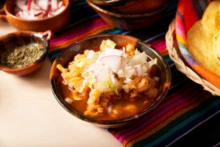 Red pozole. Traditional Mexican stew very popular in Mexico and neighboring countries. Made from cacahuazintle with meat and various other ingredients depending on the region.の写真素材