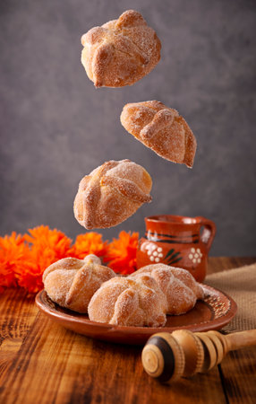 Dead Bread. Typical Mexican sweet bread that is consumed in the season of the day of the dead. It is a main element in the altars and offerings in the festivity of the day of the dead.の写真素材