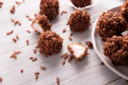 Homemade Caramel Marshmallows covered in chocolate flavor puffed rice, sweet treat easy to make, no baking required, ideal for parties and festivitiesの写真素材