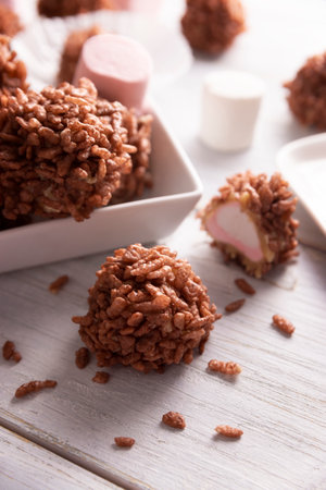 Homemade Caramel Marshmallows covered in chocolate flavor puffed rice, sweet treat easy to make, no baking required, ideal for parties and festivitiesの写真素材
