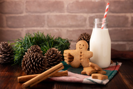 Homemade gingerbread man cookies and milk, traditionally made at Christmas and the holidays.