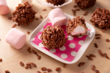 Homemade Caramel Marshmallows covered in chocolate flavor puffed rice, sweet treat easy to make, no baking required, ideal for parties and festivitiesの写真素材