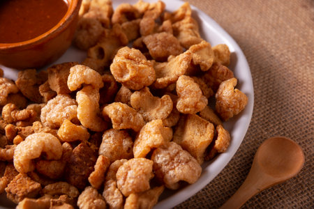 pork rinds Deep fried pork rinds, crispy pork skin pieces, traditional Mexican ingredient or snack...