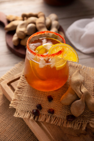 Agua de Tamarindo, is one of the traditional "Aguas Frescas" in Mexico. Infused drink made with tamarind to which beneficial health properties are attributed.の写真素材