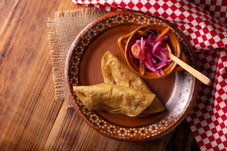 Golden quesadillas. Fried quesadillas made with corn tortillas, they can be filled with any dish or ingredient, such as meat, potato or fish such as marlin or tuna, popular during the Lenten season.の写真素材