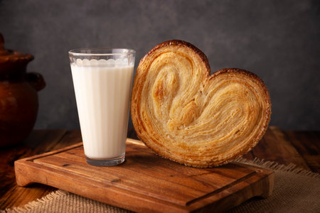 Ear. Mexican sweet bread made with puff pastry, its name comes from its shape similar to that of ears, of French origin, where it is known as Elephant Ear or Palmier Puff Pastry.の写真素材