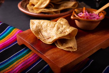Golden quesadillas. Fried quesadillas made with corn tortillas, they can be filled with any dish or ingredient, such as meat, potato or fish such as marlin or tuna, popular during the Lenten season.の写真素材